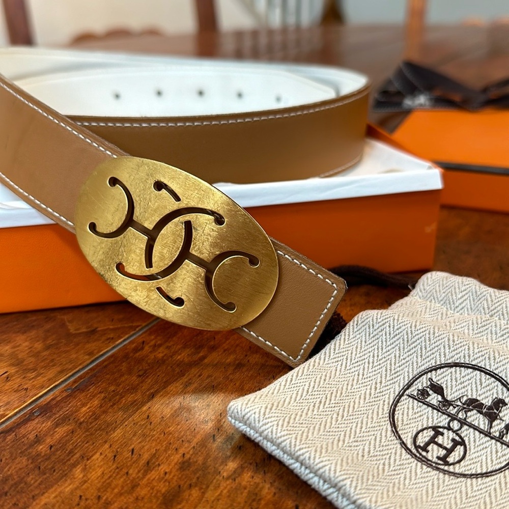 Hermes tan and white reverseable woman’s belt with gold buckle.